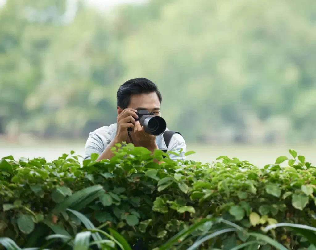 A Man of Dehradun Detective Agency Photography with DSLR Camera